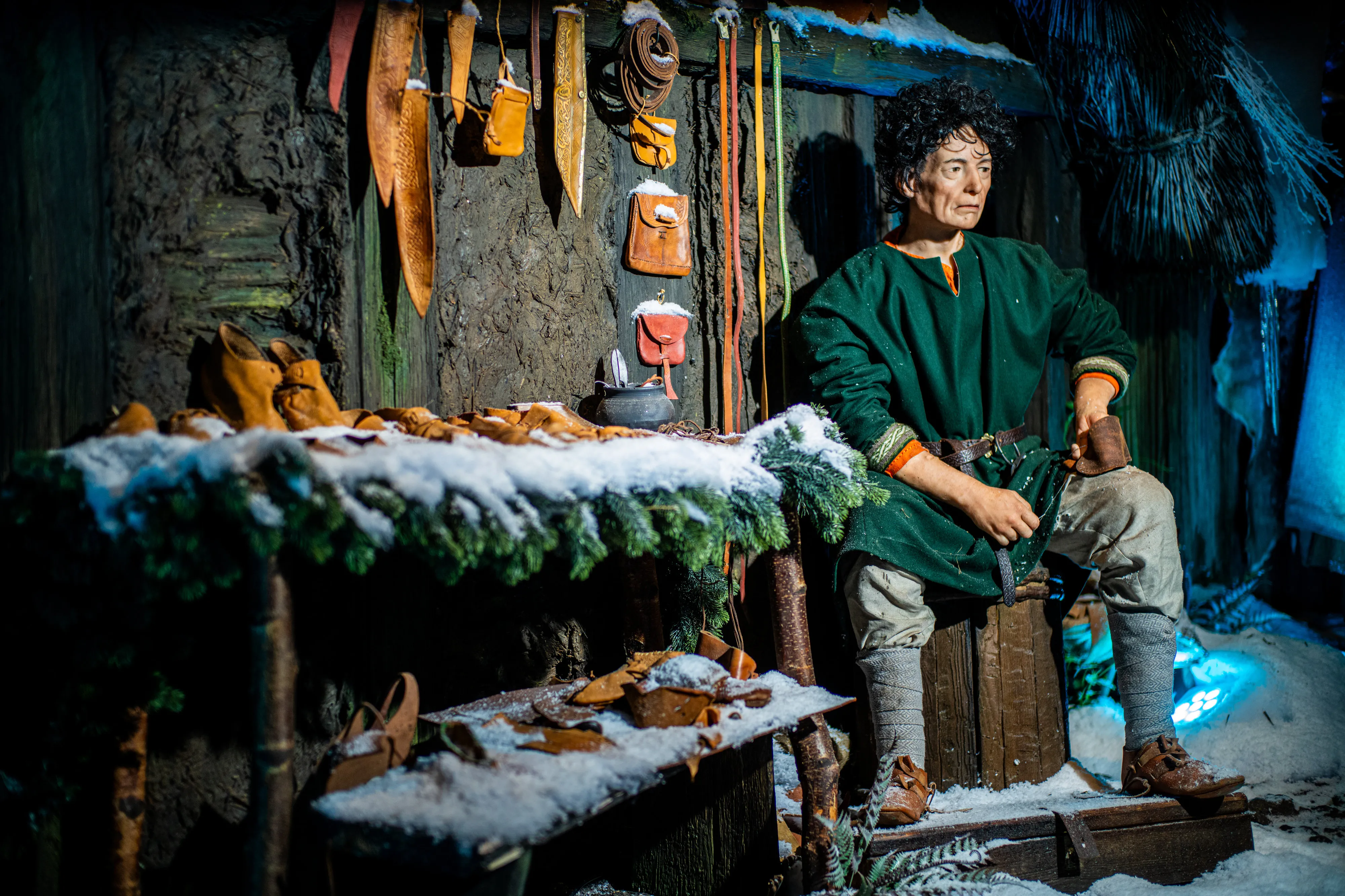 Viking sitting by his wares in a snowy scene, image by Charlotte Graham.